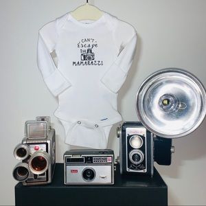 Can’t Escape The Mamarazzi Onesie